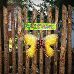 Wrought iron butterfly welcome sign