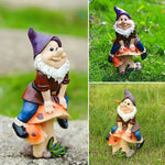 Garden Gnome Sits On Mushroom Decoration
