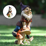 Garden Gnome Sits On Mushroom Decoration